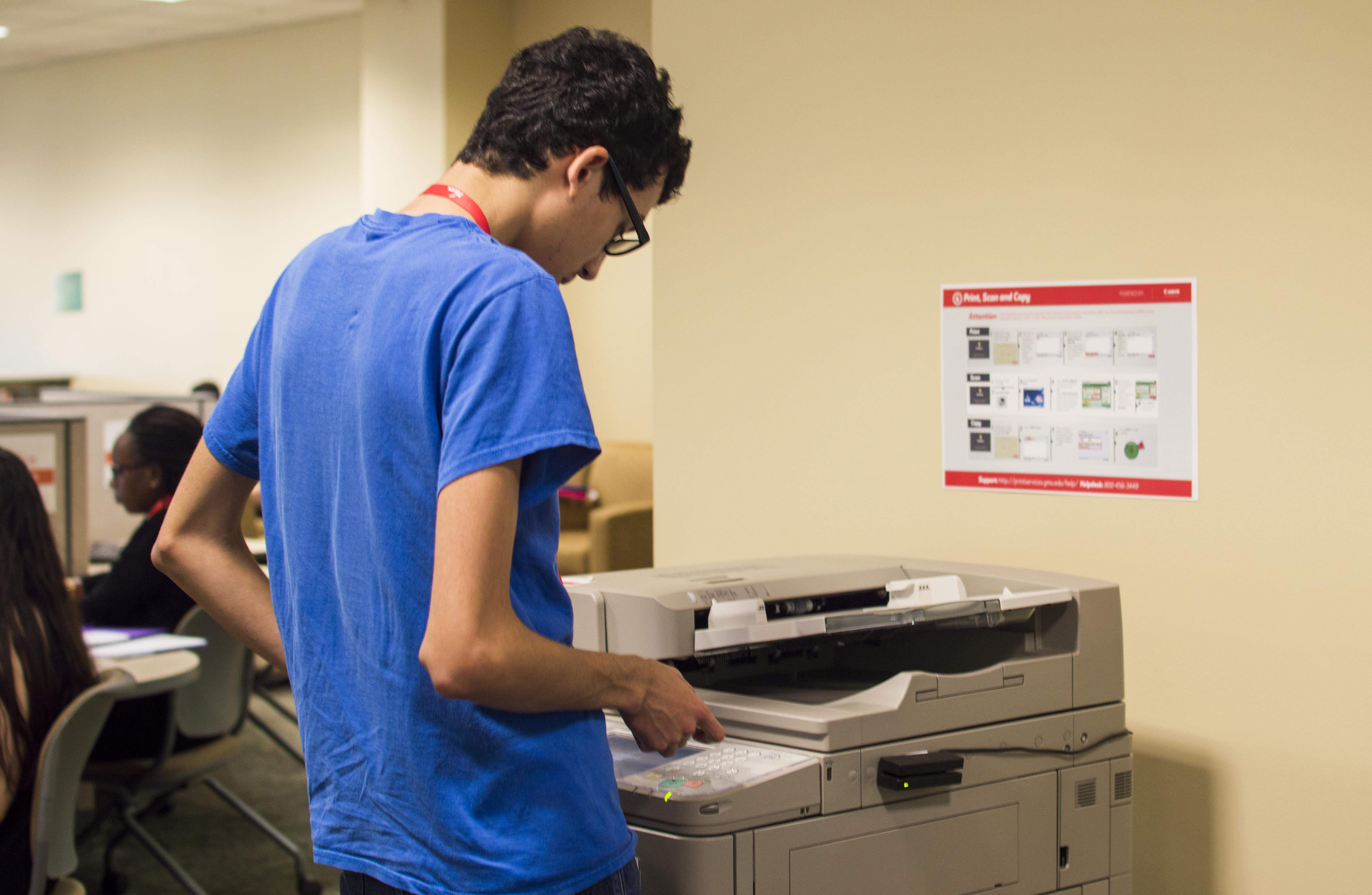 Student using one of the copiers at the JC. (Photo credit: Alya Nowilaty) 